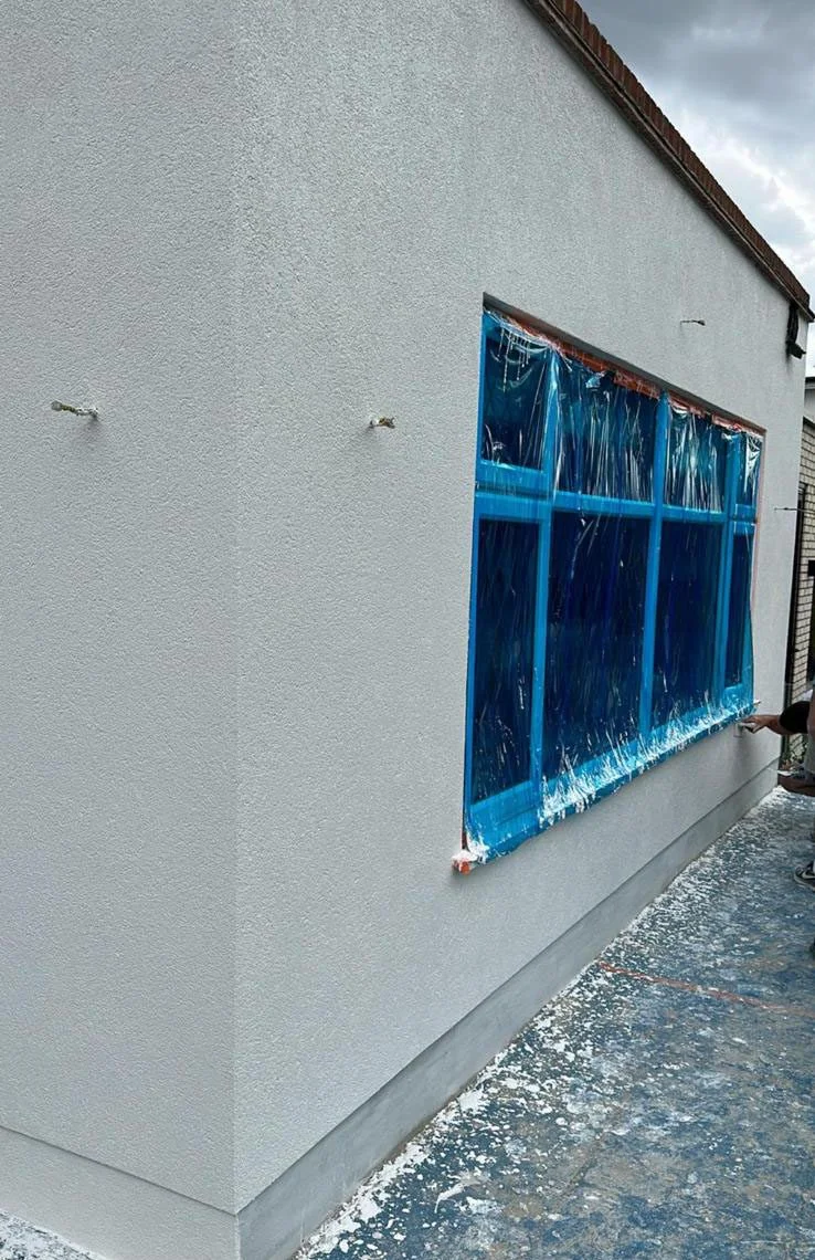 Plastering In Hersham — freshly plastered and painted wall in a Surrey property