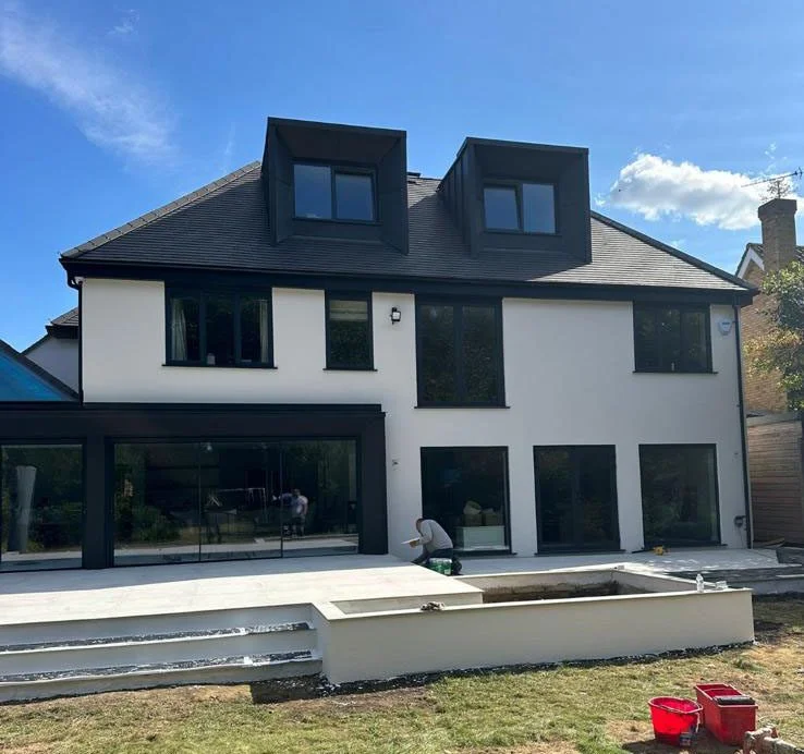 Modern two-storey house with smooth white render finish in Esher Surrey.