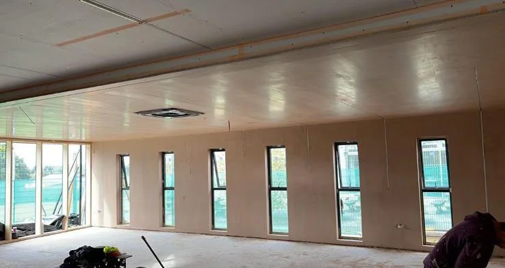 Smooth ceiling and wall plastering work inside modern property in Weybridge Surrey.