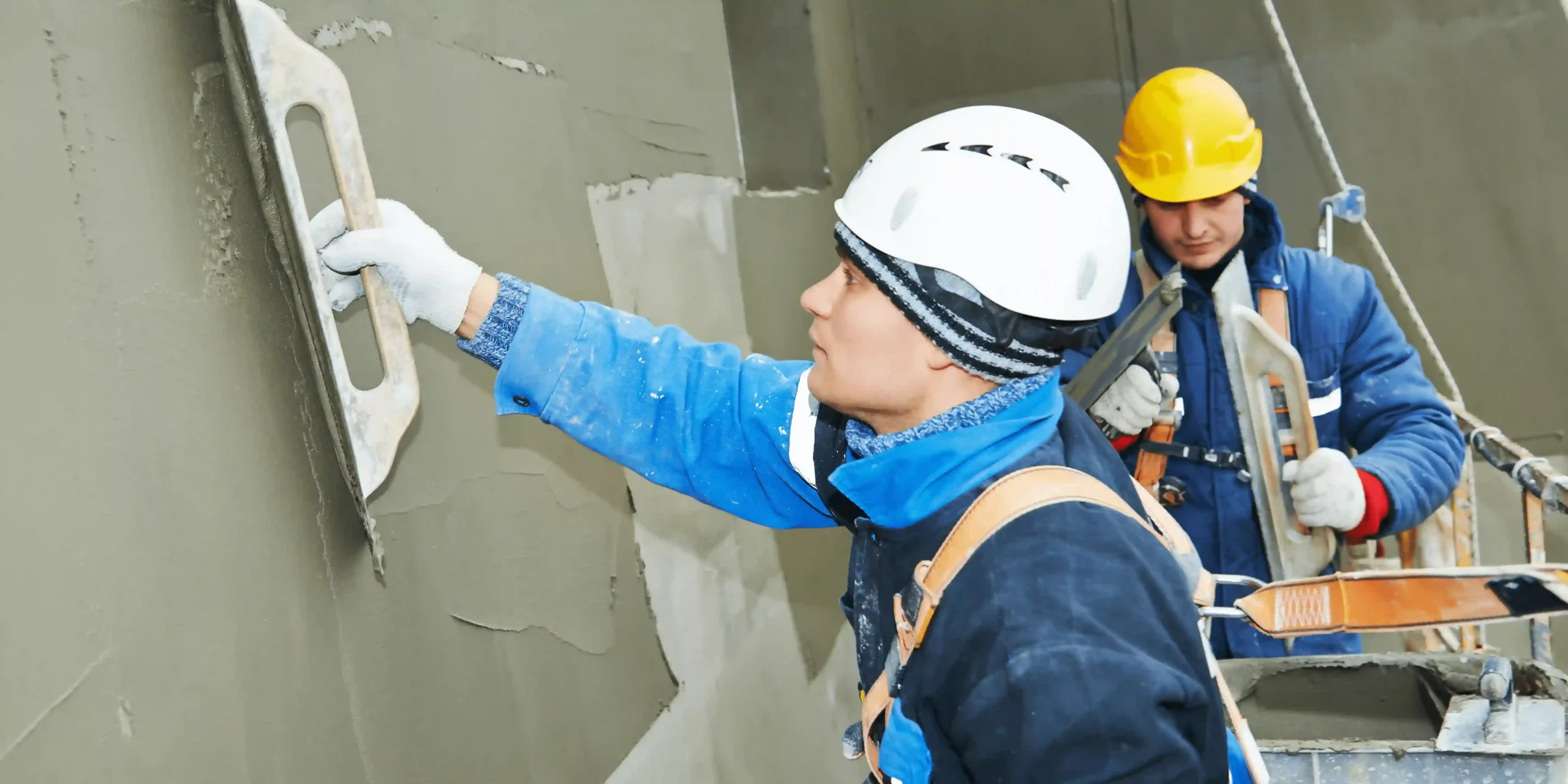 Surrey Plastering and Rendering Company team working on a plastering project in Surrey