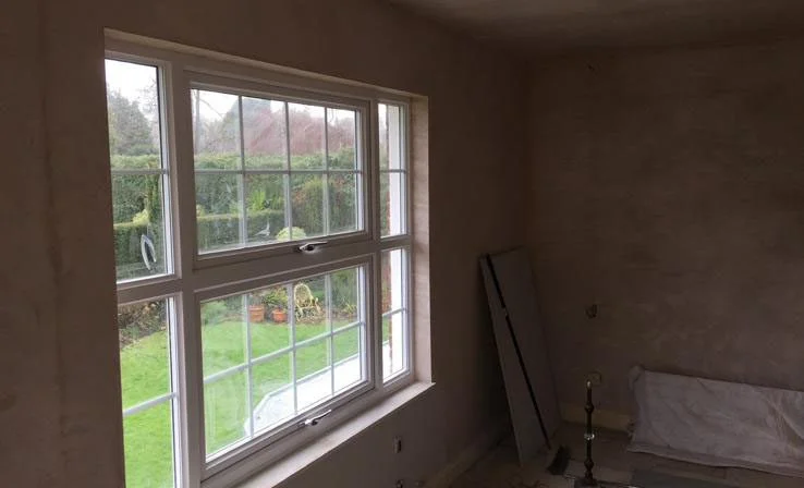 Why choose Surrey Plastering and Rendering — quality plastering work near a window in East Horsley Surrey